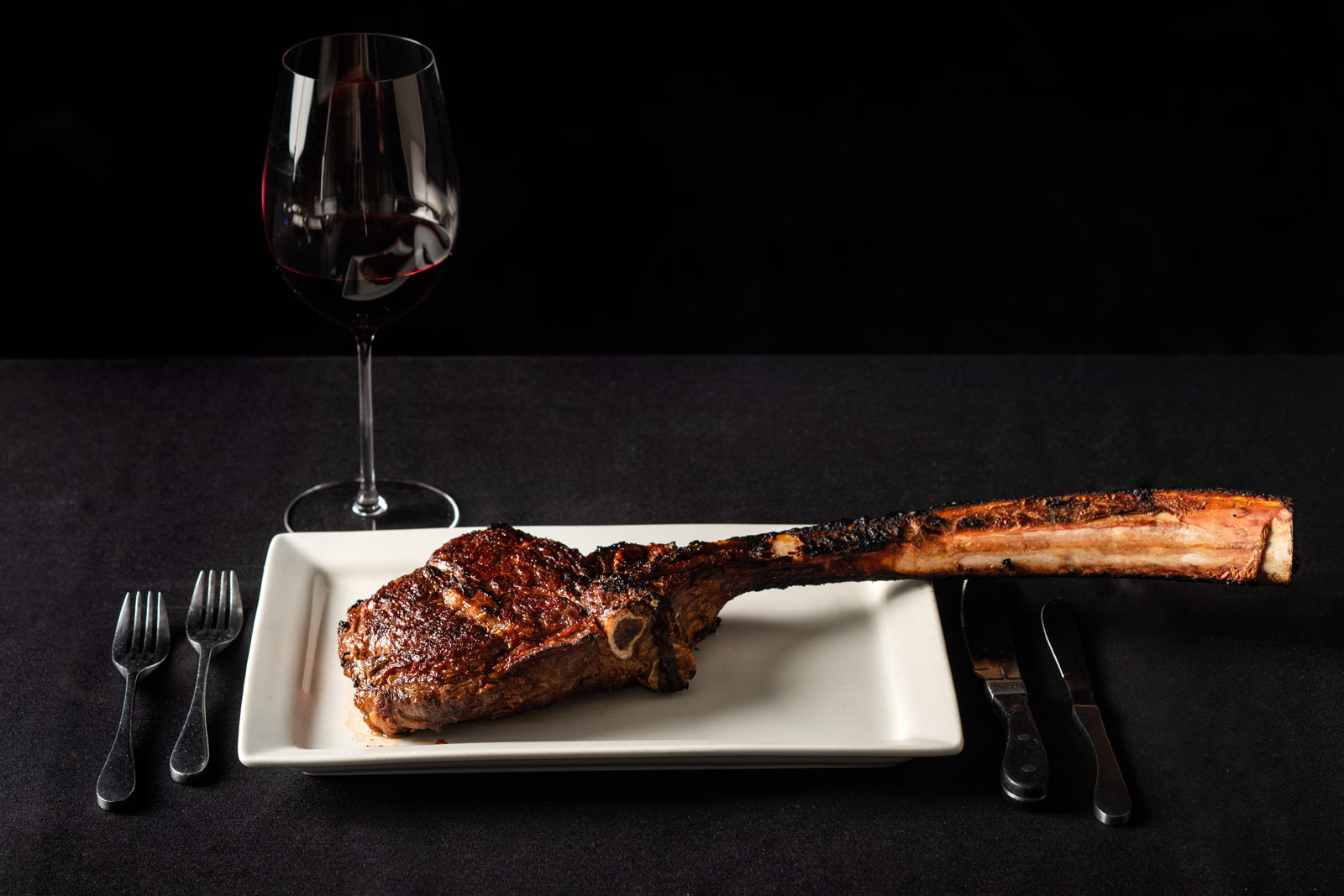 Scotch and Sirloin signature brand photo of a Tomahawk steak